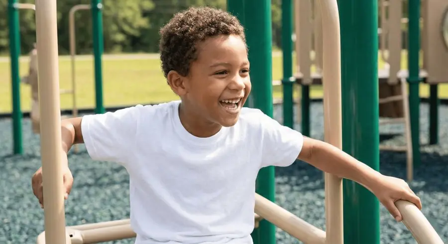 A smiling child playing outdoors