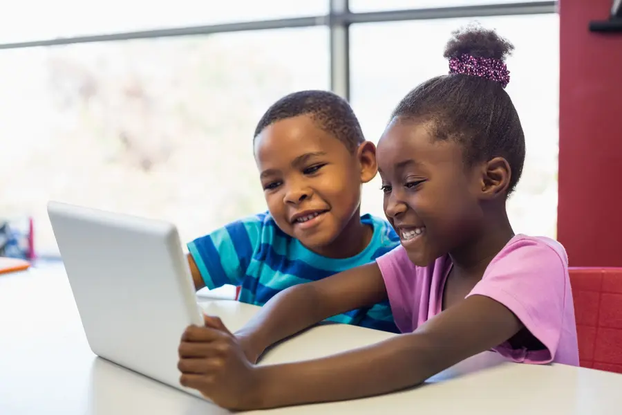 Children learning together with a tablet